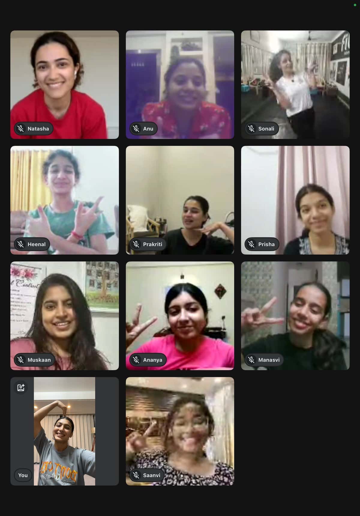 Eleven students dancing together in the live online class, seen as a video-call grid