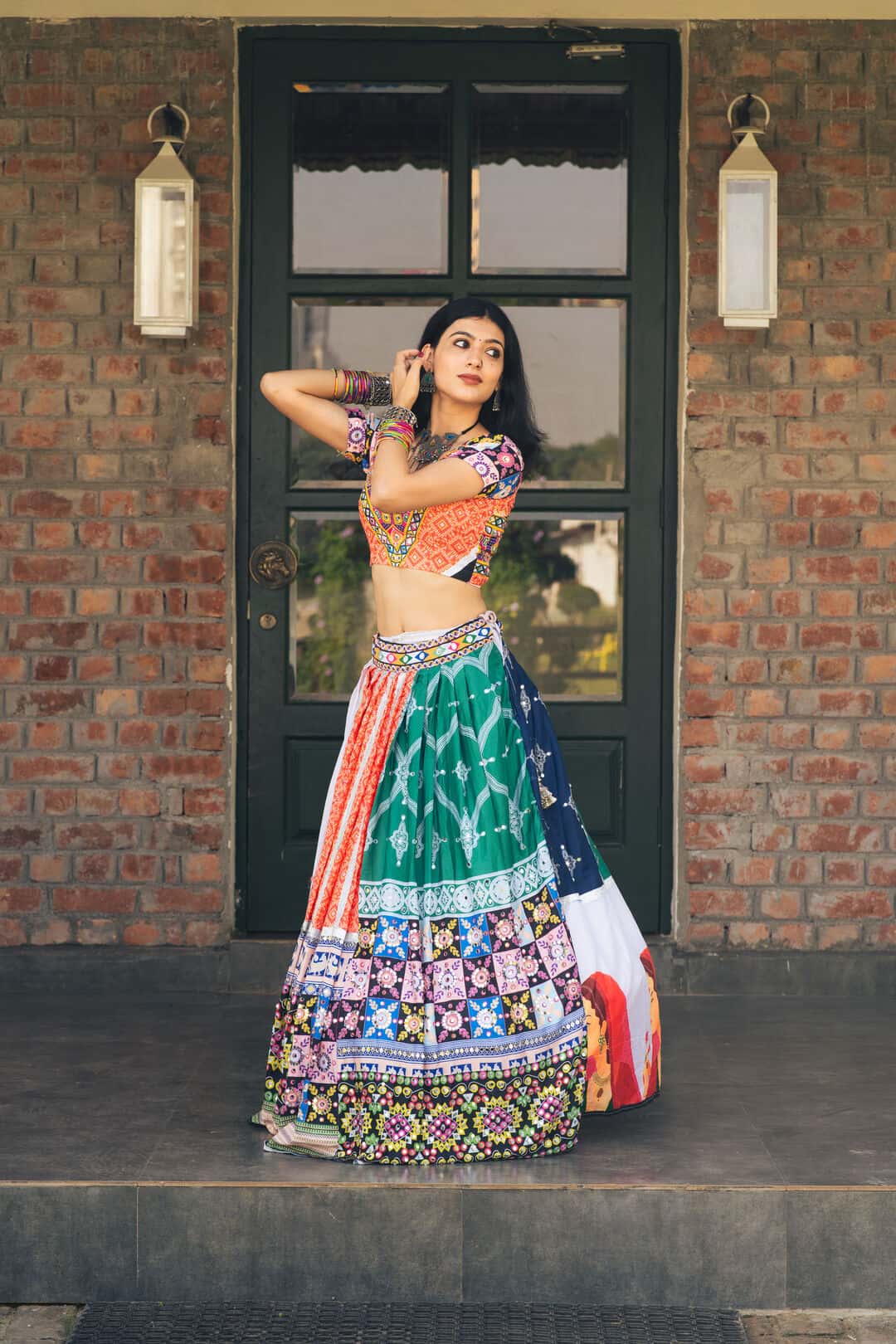 Sanya Ohri in a mirrorwork lehenga, mid-pose
